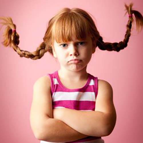 young girl with red pigtails