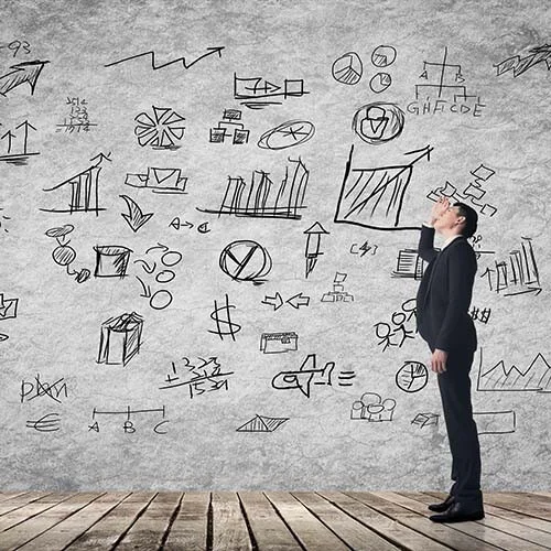 man looking confused at process on wall