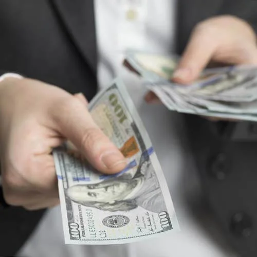 Man handing out money