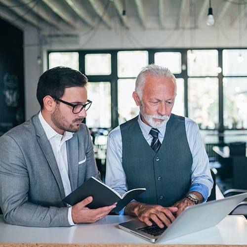 Two men looking at document