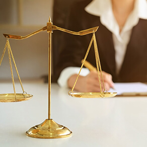 woman in law office writing contract