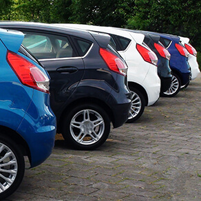 Line of cars in auto dealership