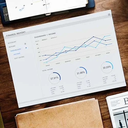 finance report with computer in background