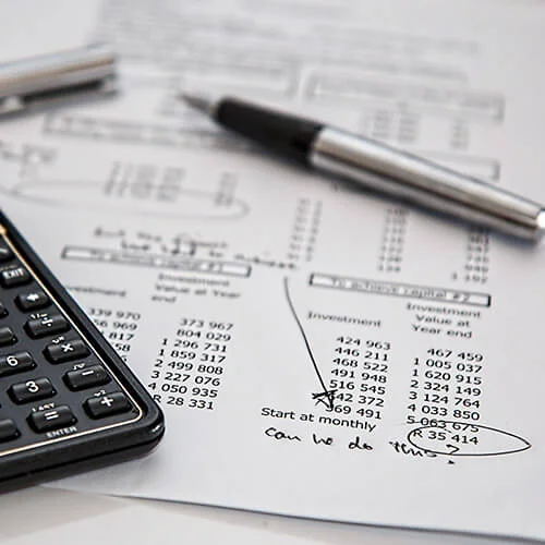 financial statement with calculator and pen for nonprofit investments